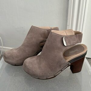Gray suede mules.